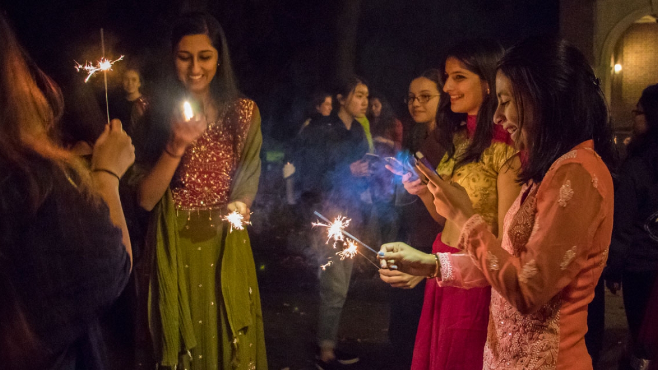 Students celebrate Diwali by Alumnae Hall