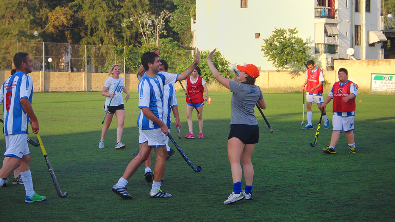 High fives and smiles for Wellesley Field Hockey players abroad