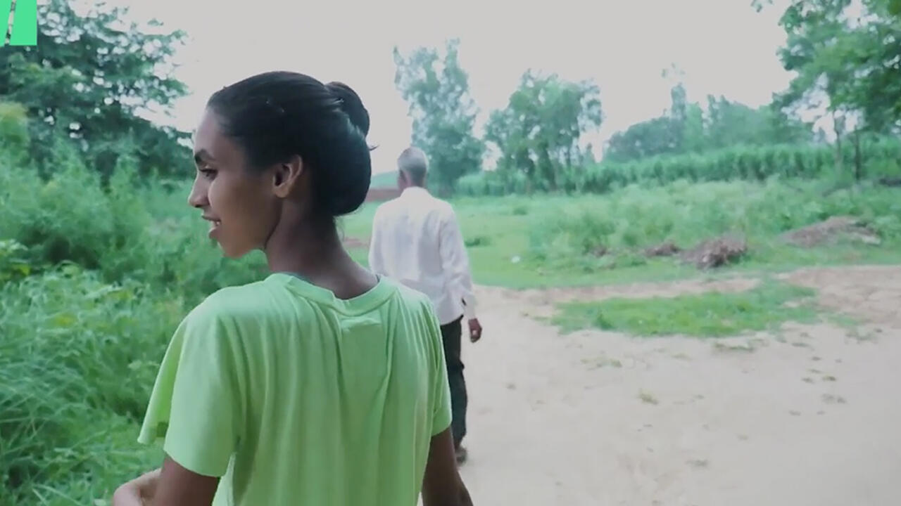 Wellesley student Manvi Chaudhury walks through her village in Uttar Pradesh, India