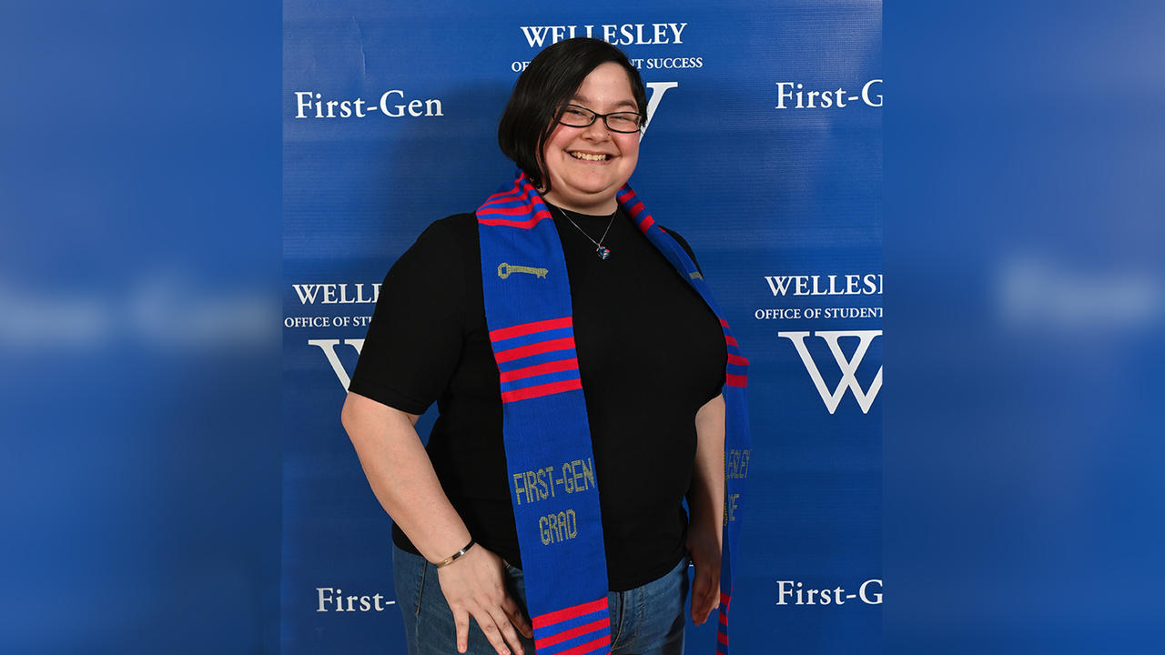 Mikhaela Andersonn poses with her First-Gen stole around her shoulders. 