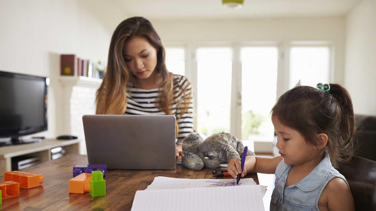 mom working from home with young child