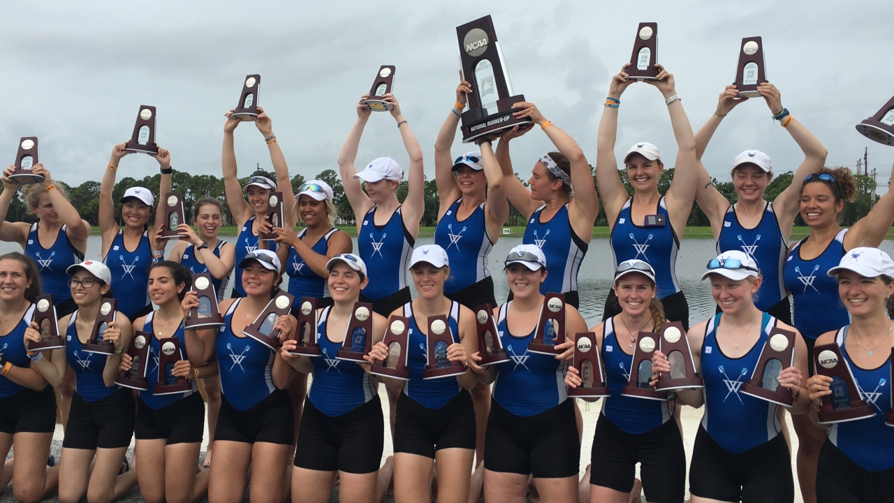 The Wellesley Blue Crew team holds up trophies after placing in national competition 