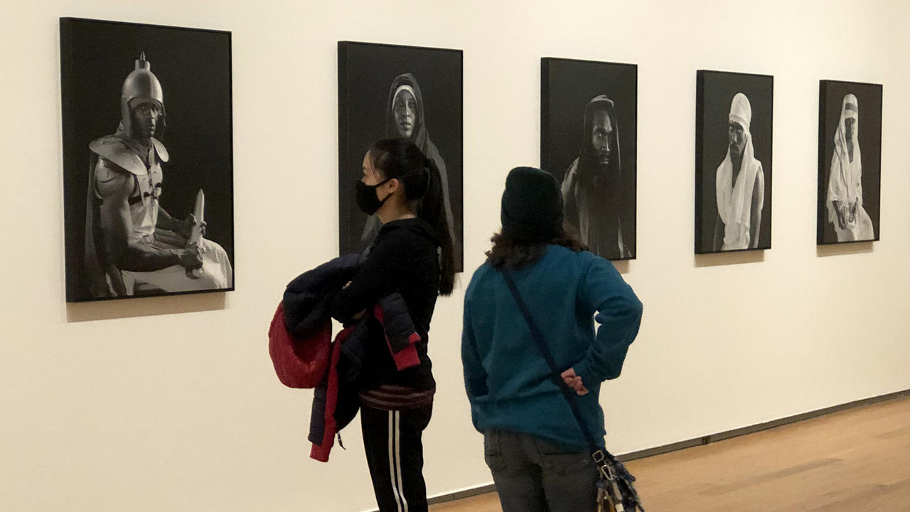 Visitors to the Davis museum look at the Prison Nation exhibit. 