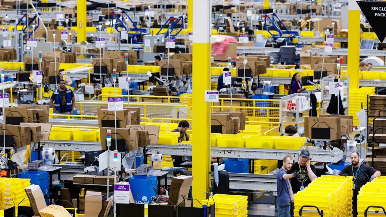 workers in an Amazon shipping warehouse