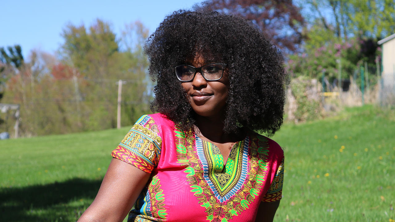 Sylvia Matua poses for a photo outside.