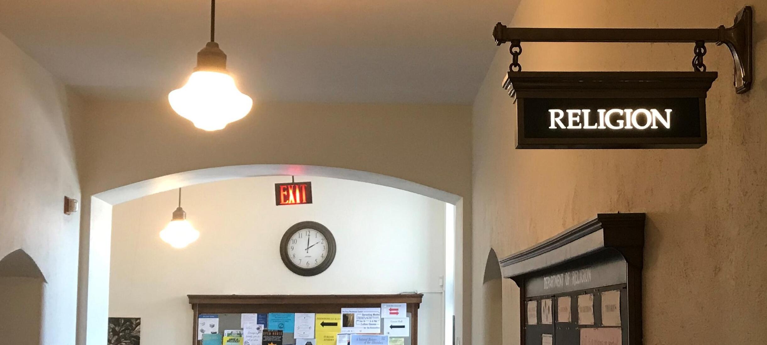Religion Department sign outside of the office in Founders Hall