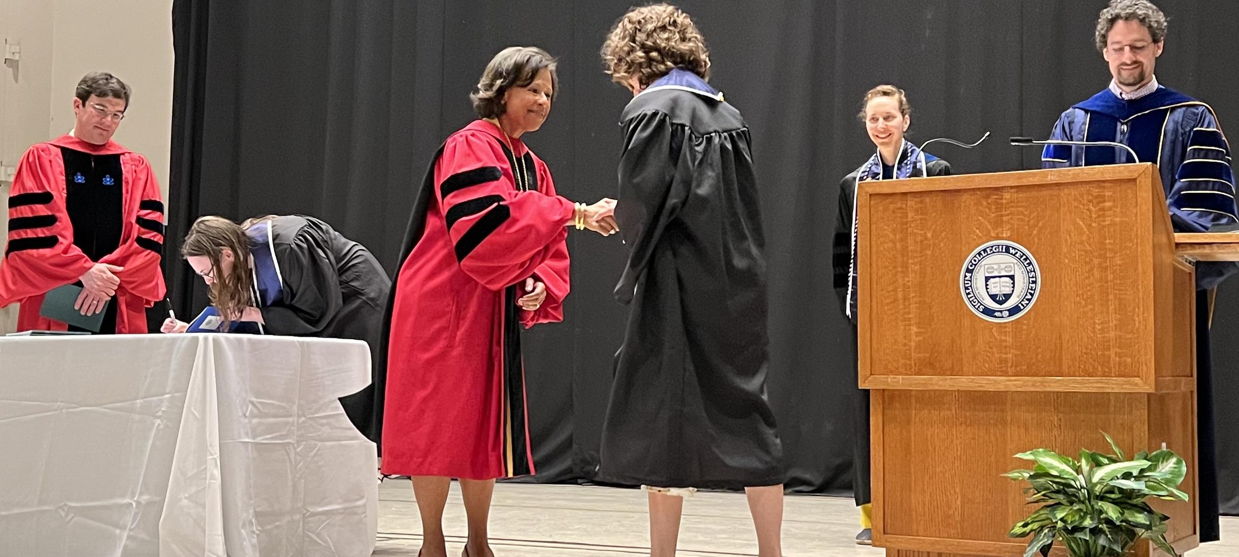 President Johnson shaking hands with a new inductee