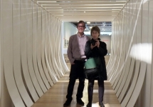 Professor James Oles and former photography teacher Judy Black inside Helen Escobedo's "White Corridor"