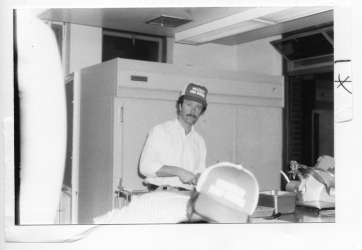 1983 chef cooking in kitchen