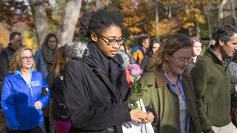 Community joins President Johnson in a peace walk through campus.